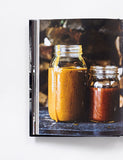 Myron Mixon's BBQ Rules by Myron Mixon hardback cookbook — interior page of homemade barbecue sauces in jars