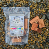 Natural Smoke BBQ Woods Ironbark wood chunks 1kg bag on location with raw wood chunks