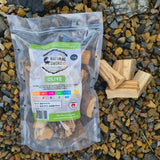 Natural Smoke BBQ Woods Olive wood chunks 1kg bag on location with raw wood chunks