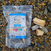 Natural Smoke BBQ Woods Pecan wood chunks 1kg bag on location with raw wood chunks