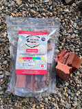 Natural Smoke BBQ Woods Red Gum wood chunks 1kg bag on location with raw wood chunks