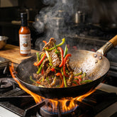 Nomad Chilli Co Tamarind Gold hot sauce — beef and capsicum stir-fry tossed in a flaming wok