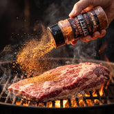 Big GCs Sweet Beef rub shaken onto a beef brisket on the grill