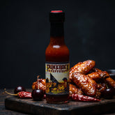 Punk Rock Peppers Suicidal reaper hot sauce styled with hot wings