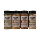 Outlaw Barbecue four pack BBQ rub bundle 1.05kg — Lawless, Bushranger, Stockman CRUST and Gold Rush shakers on a transparent background