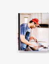 Pizza Camp by Joe Beddia hardback cookbook — Dough chapter opener with Joe at work