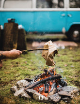 Road Trip Cooking by The Holy Kauw Company paperback cookbook — interior page of a paper-bag breakfast over the campfire