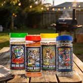 Stef the Maori The Full Stef bundle — all four seasoning shakers together on a backyard barbecue picnic table with the smoker going