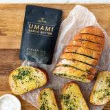 Rum and Que Umami Garlic Butter finishing seasoning — sliced garlic bread with the pouch alongside