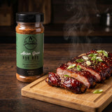 Smokes Asian Spice BBQ rub — sliced char siu-style pork ribs with sesame and spring onion on a bamboo board