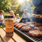 Smokes The Standard all-purpose BBQ rub — backyard grill with sausages, burgers and steaks searing