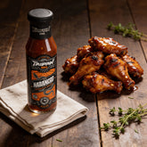 TAIPAN BBQ Habanero medium smoky-sweet BBQ sauce 250ml — beauty shot, glazed chicken wings glistening with sauce