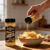 TAIPAN BBQ Kartoffen potato & chip sprinkle 175g — in-use shot, sprinkling seasoning over fresh hot chips