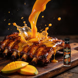 TAIPAN BBQ Mango Madness Sunday Glaze sweet mango BBQ glaze 250ml — action shot, glaze drip freeze-frame over ribs
