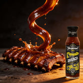 TAIPAN BBQ Oaxaca mild smoky-sweet BBQ sauce 250ml — action shot, dramatic sauce pour freeze-frame over ribs