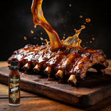 TAIPAN BBQ Smoky Glaze mild smoky BBQ glaze 250ml — action shot, glaze drip freeze-frame over ribs