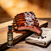 TAIPAN BBQ Smoky Glaze mild smoky BBQ glaze 250ml — beauty shot, glossy glazed pork ribs with smoke ring