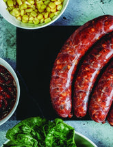 The Butcher's Cook Book Volume Two by 50 Australian Butchers paperback cookbook — grilled sausages with fresh sides