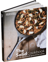 The Solid Cookbook Vol. 1 by Solidteknics hardback cookbook — front cover standing on stone