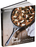 The Solid Cookbook Vol. 1 by Solidteknics hardback cookbook — front cover standing on stone