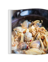 The Solid Cookbook Vol. 1 by Solidteknics hardback cookbook — interior page of clams with white wine and white fish