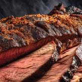 Tillman's Barbecue Competition Brew sauce glazed on sliced smoked brisket, close-up lifestyle shot