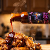 Valkyries Vision sauce drizzled over hot chicken wings