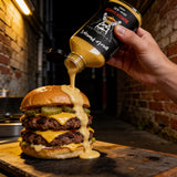 Uncle Mungo's Burger Sauce 200ml smoky burger sauce — squeezing smoky burger sauce onto a double smash burger