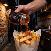 Uncle Mungo's Chipotle Chicken Salt 250g chipotle chicken salt — shaking chipotle chicken salt over hot chips