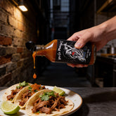 Uncle Mungo's Covid-19 200ml four-pepper superhot hot sauce — adding a few drops of Covid-19 superhot sauce to pork tacos