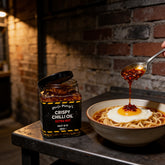 Uncle Mungo's Crispy Chilli Oil Extra Hot 285g extra hot crispy chilli oil — extra hot crispy chilli oil beside noodles with a fried egg