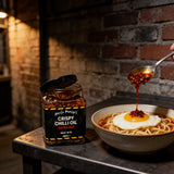 Uncle Mungo's Crispy Chilli Oil Extra Hot 285g extra hot crispy chilli oil — extra hot crispy chilli oil beside noodles with a fried egg