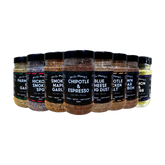 Uncle Mungo's The Lot 8-pack rub and seasoning bundle — front of shakers on transparent background