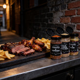 Uncle Mungo's The Lot 8-pack rub and seasoning bundle — the rub and seasoning range beside a board of brisket, ribs and wings