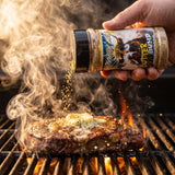 Butter Bump seasoning shaken onto a buttery steak on the grill