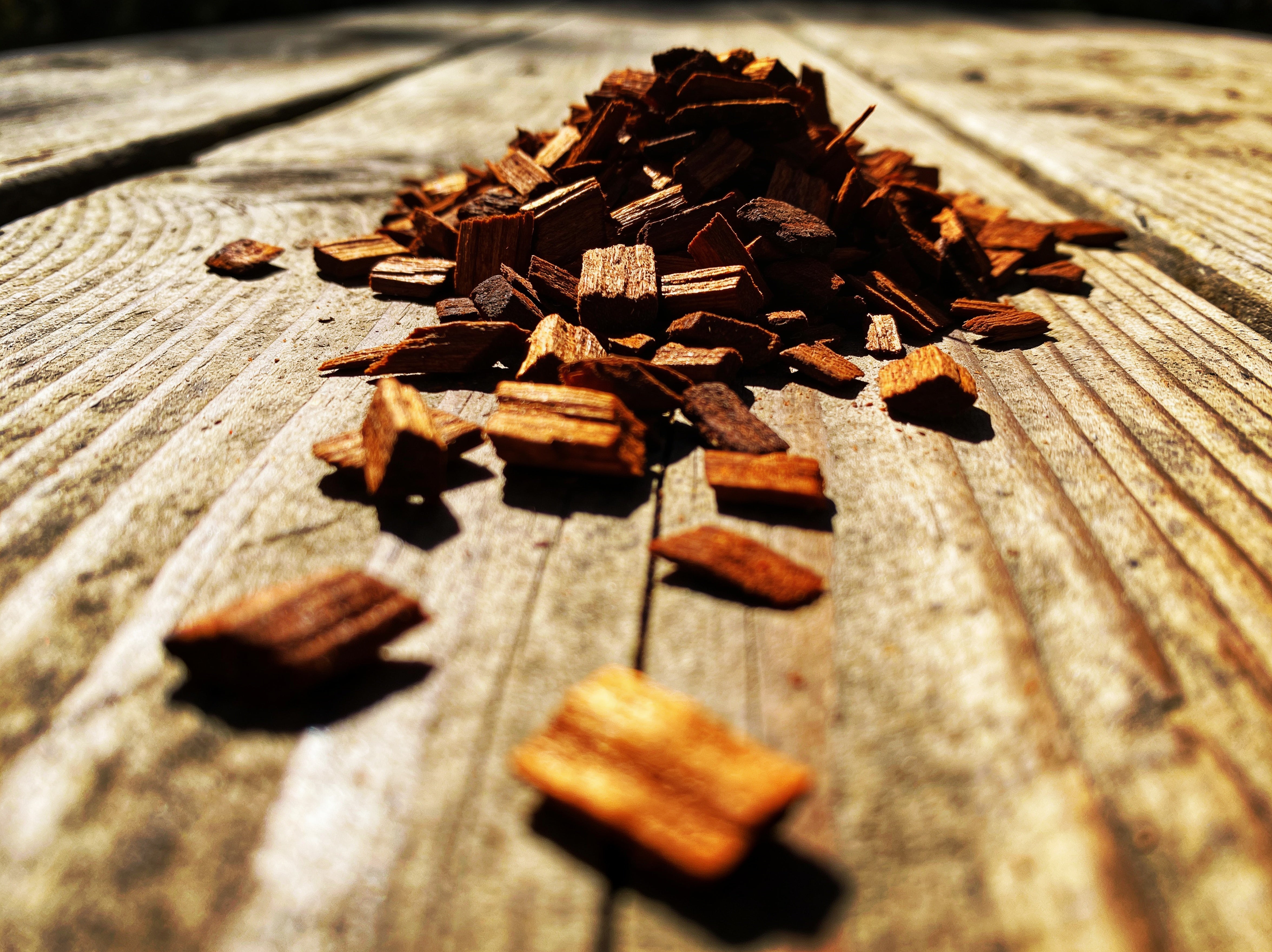 Western BBQ Products Hickory Smoking Wood Chips lifestyle photo — close-up beauty shot of raw hickory wood chips