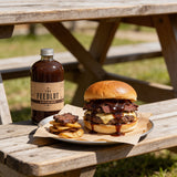 THE FEEDLOT Barnyard Brew Espresso BBQ Sauce - finished brisket burger with sauce
