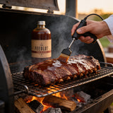 THE FEEDLOT Trailblazer Texas Style BBQ Sauce - being mopped onto brisket in the smoker