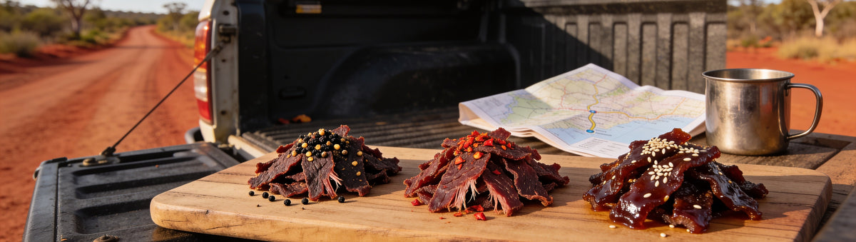 3099 Jerky Build-Your-Own 3-Pack — three flavours of beef jerky on a timber board on an outback ute tray