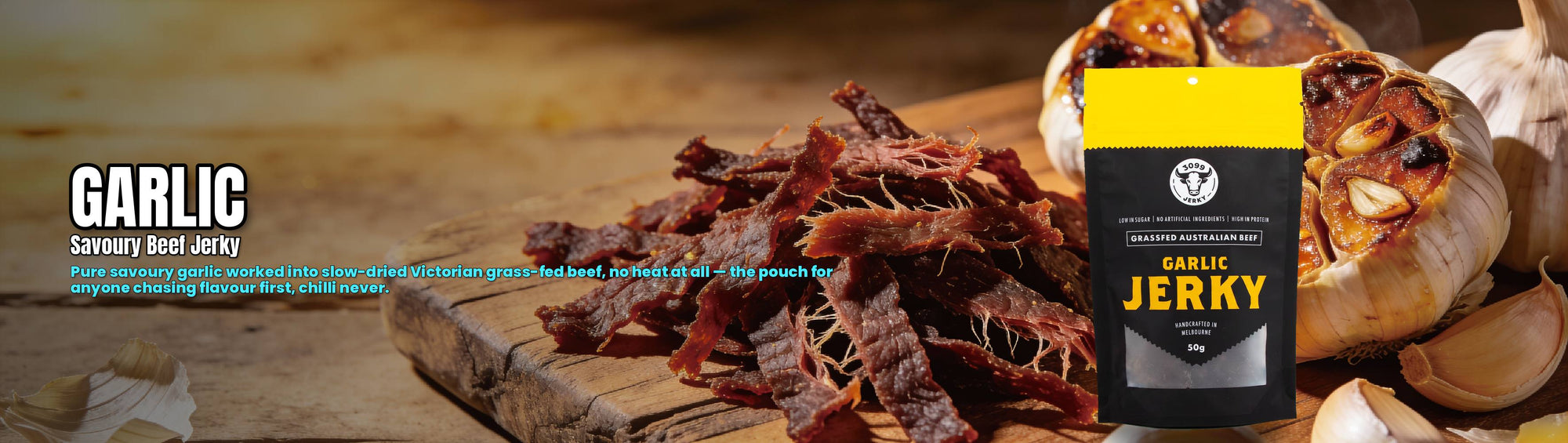 3099 Jerky Garlic Beef Jerky 50g — torn garlic beef jerky beside roasted garlic with the pouch