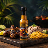 Fire Of The Phoenix Caribbean rum hot sauce styled with jerk chicken and rice and peas