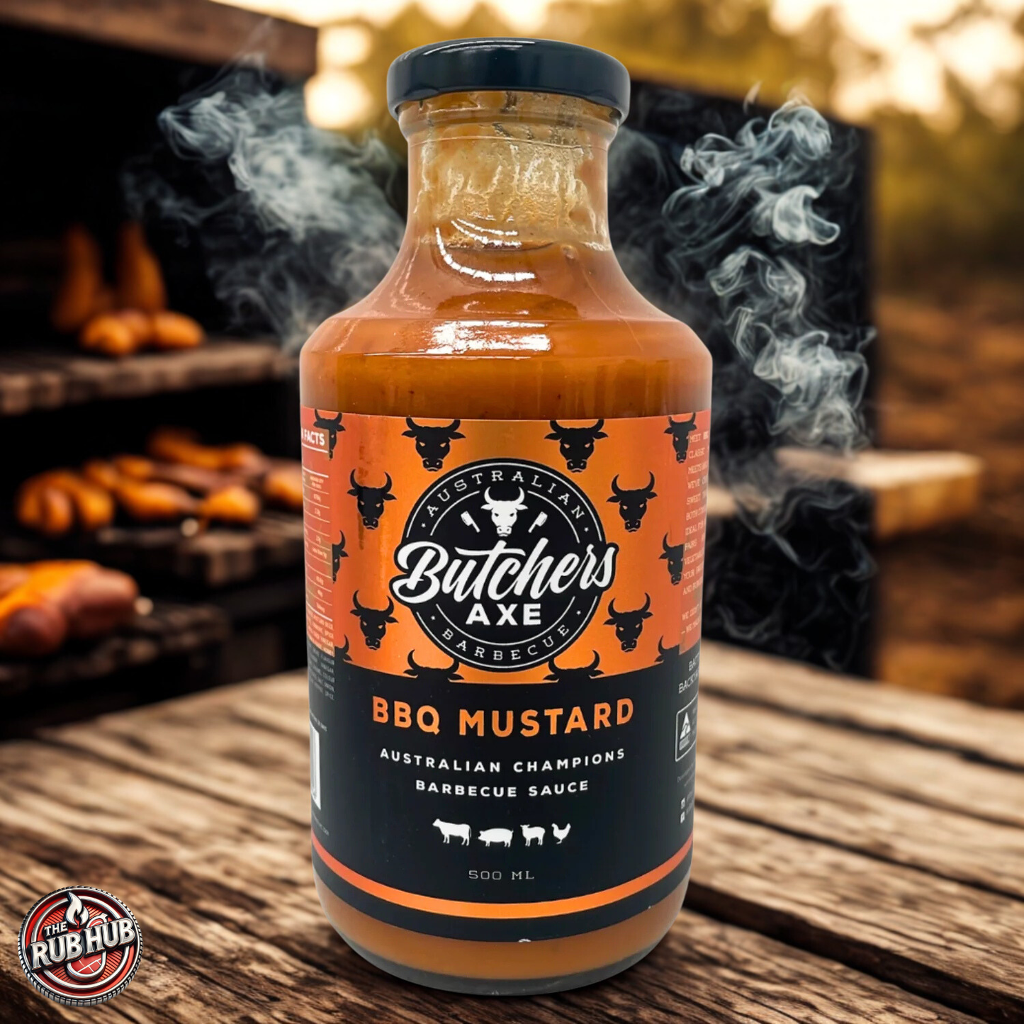 Butchers Axe BBQ Mustard Sauce 500 ml bottle front on a wooden surface with smoke in the background