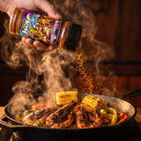 Soul Creole seasoning shaken over blackened prawns and corn