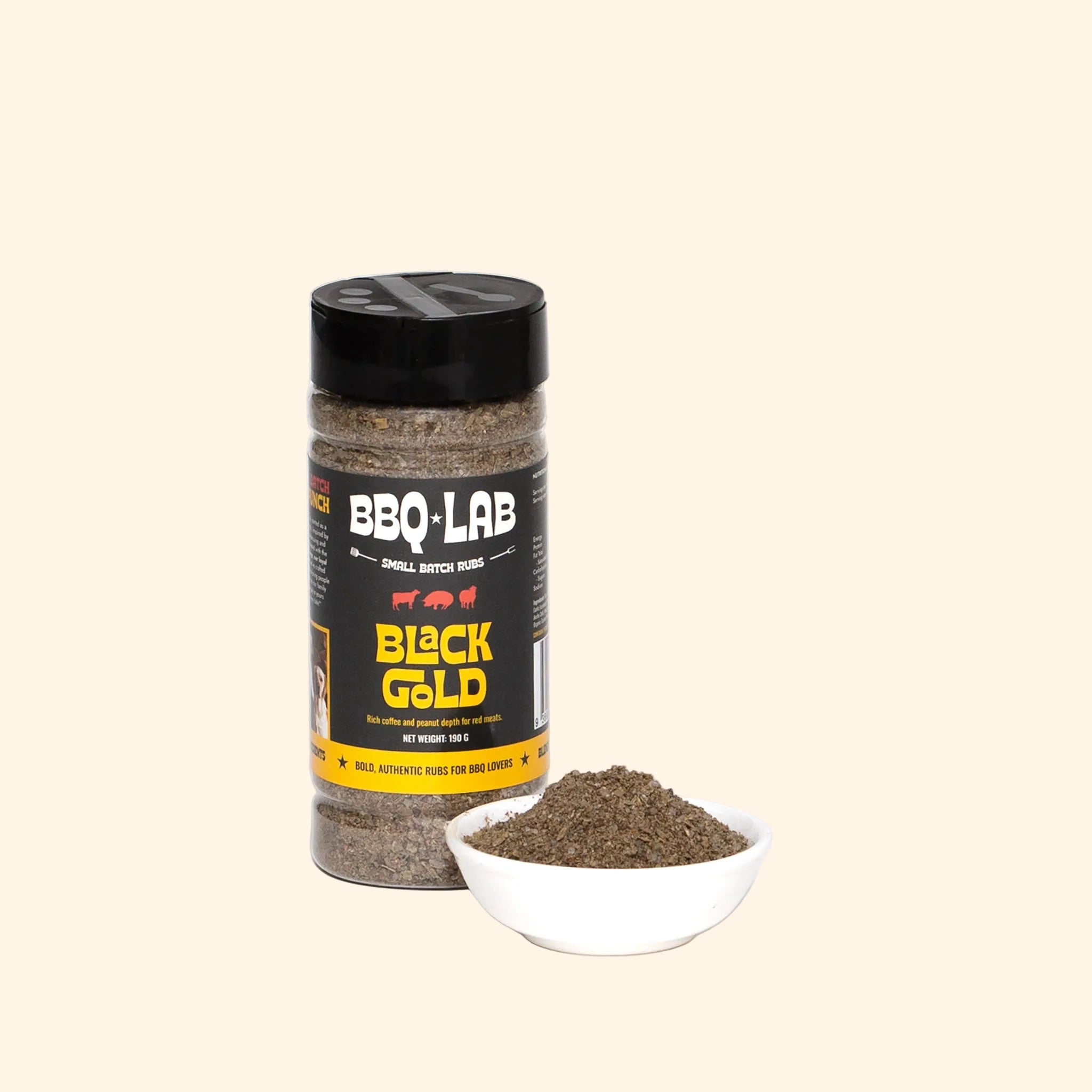BBQ Lab Black Gold rub in a small bowl beside the jar