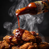 Suicidal cherry reaper hot sauce drizzled over hot chicken wings