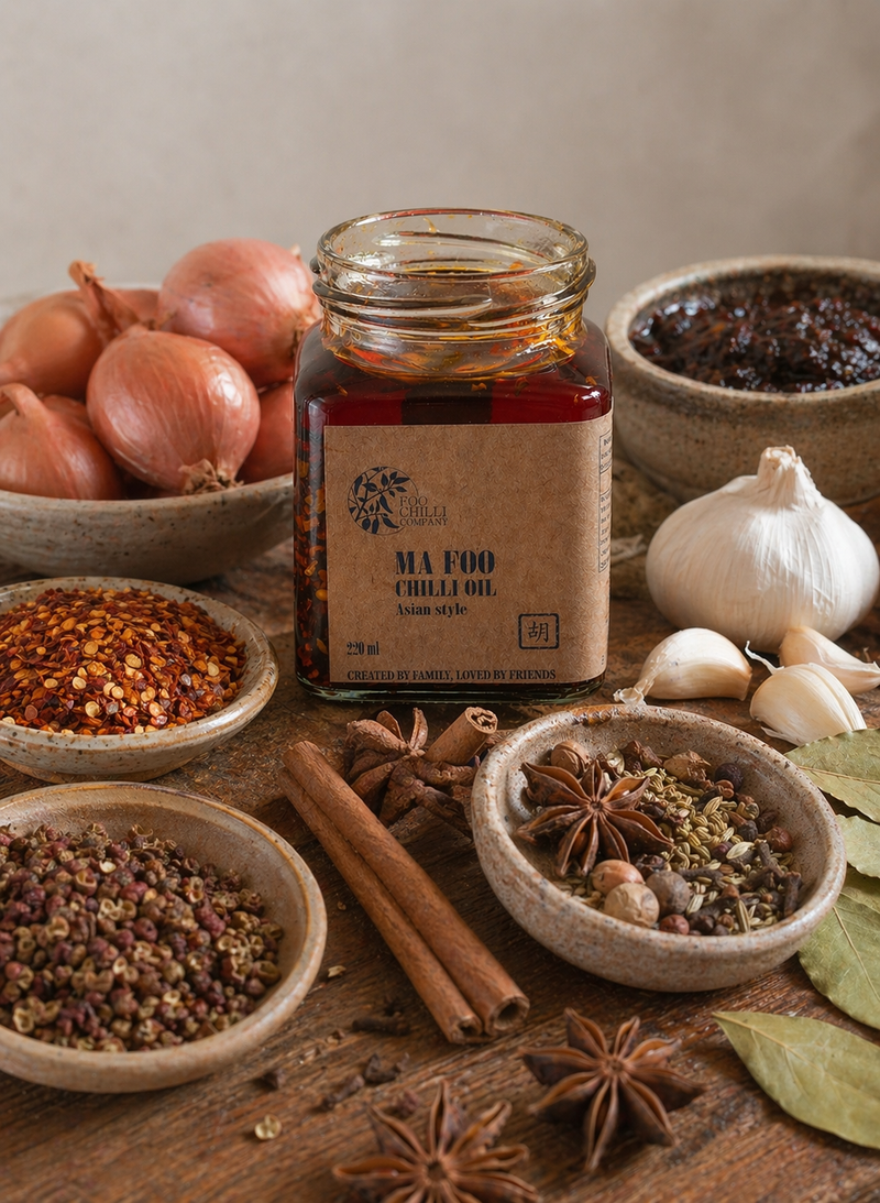 Ma Foo Chilli Oil jar styled with its ingredients including star anise, cinnamon and Sichuan peppercorns lifestyle photo