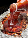 Hardcore Carnivore Saucesome BBQ sauce being poured