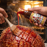 Hallelujah Hustle glaze brushed onto a baked ham