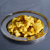 ACIDE Curried Cauliflower golden pickled florets served on a board