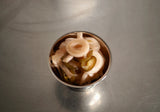 ACIDE Jalapeño Onions pickled hot-pink red onions served in a dish